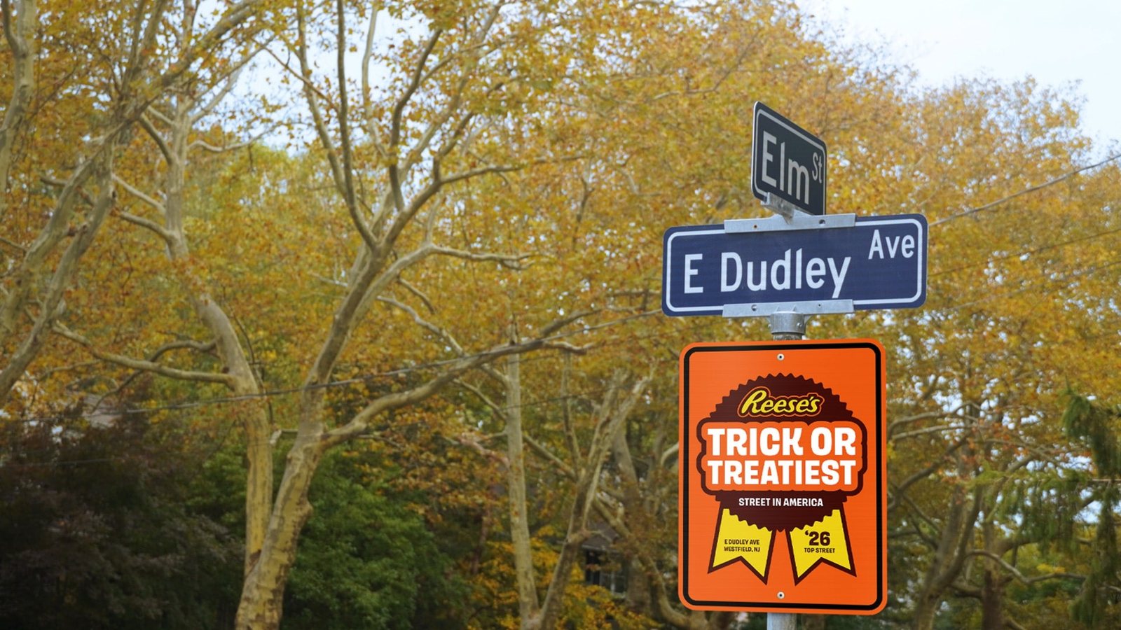 East Dudley Avenue and Elm Street signs above Reese's 2026 Trick-or-Treatiest Street in America award in Westfield, NJ