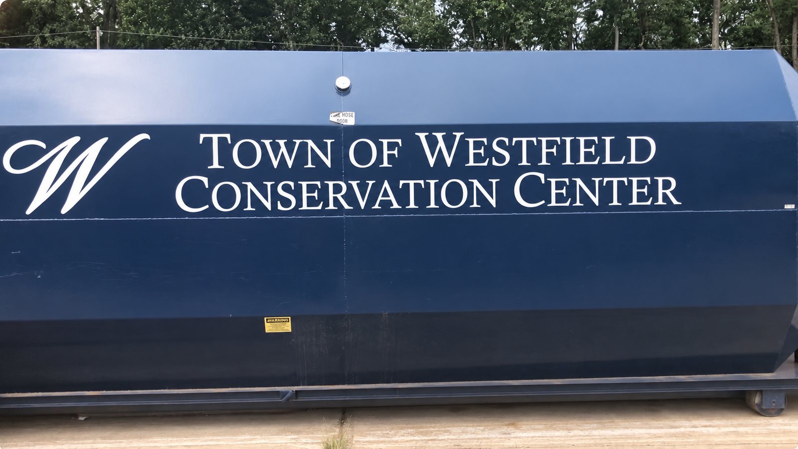 Town of Westfield Conservation Center lettering on the navy blue facility container